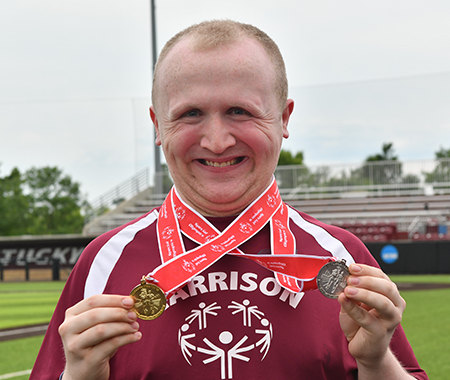 Athlete showing off medals