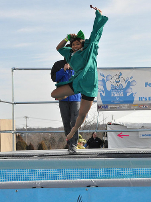 A leaping lawyers & SOKY Board Member from Polar Bear Plunge 2023